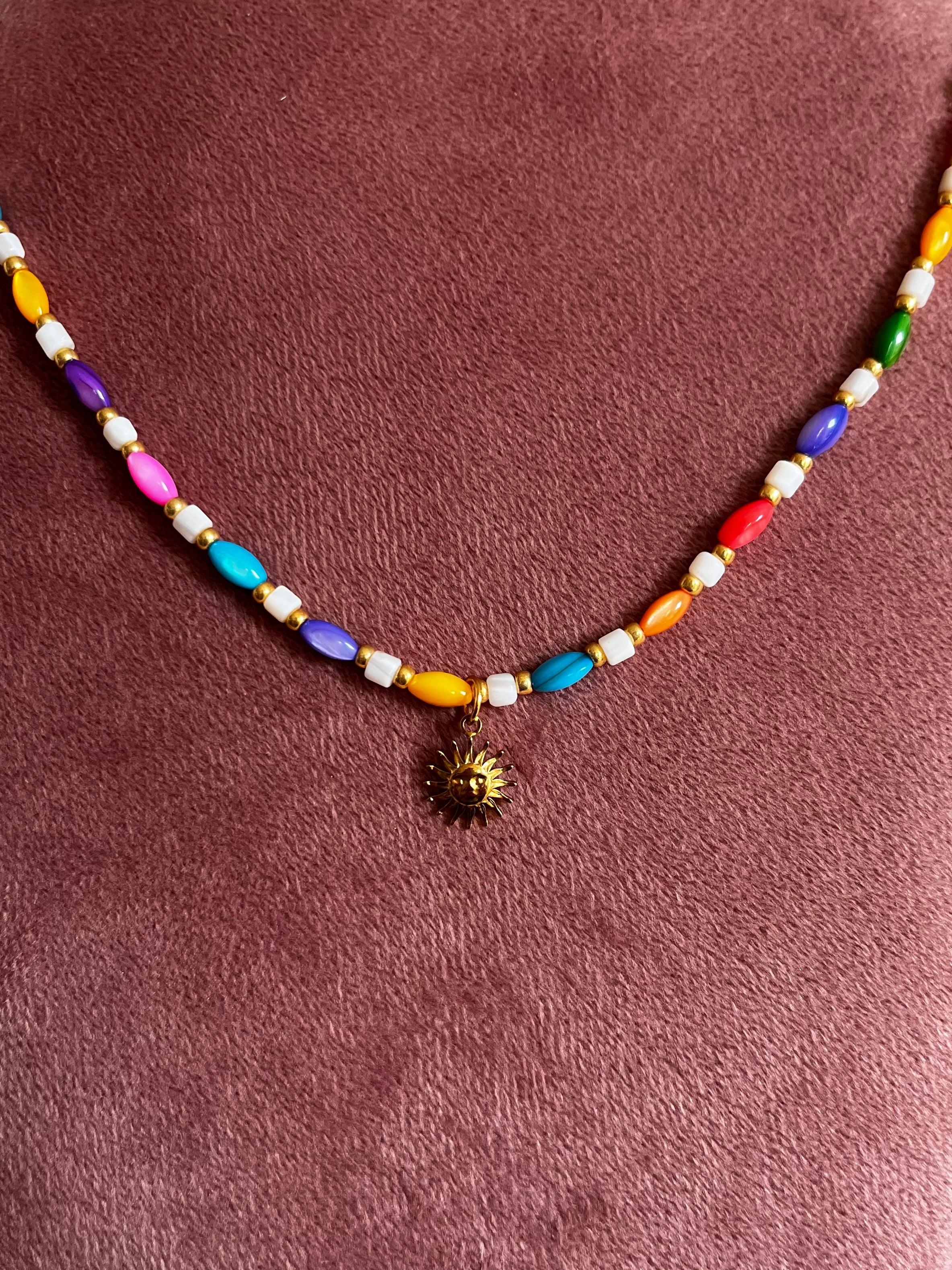 Kralenketting Lichtblauw & Meerkleurig met Zon Bedel