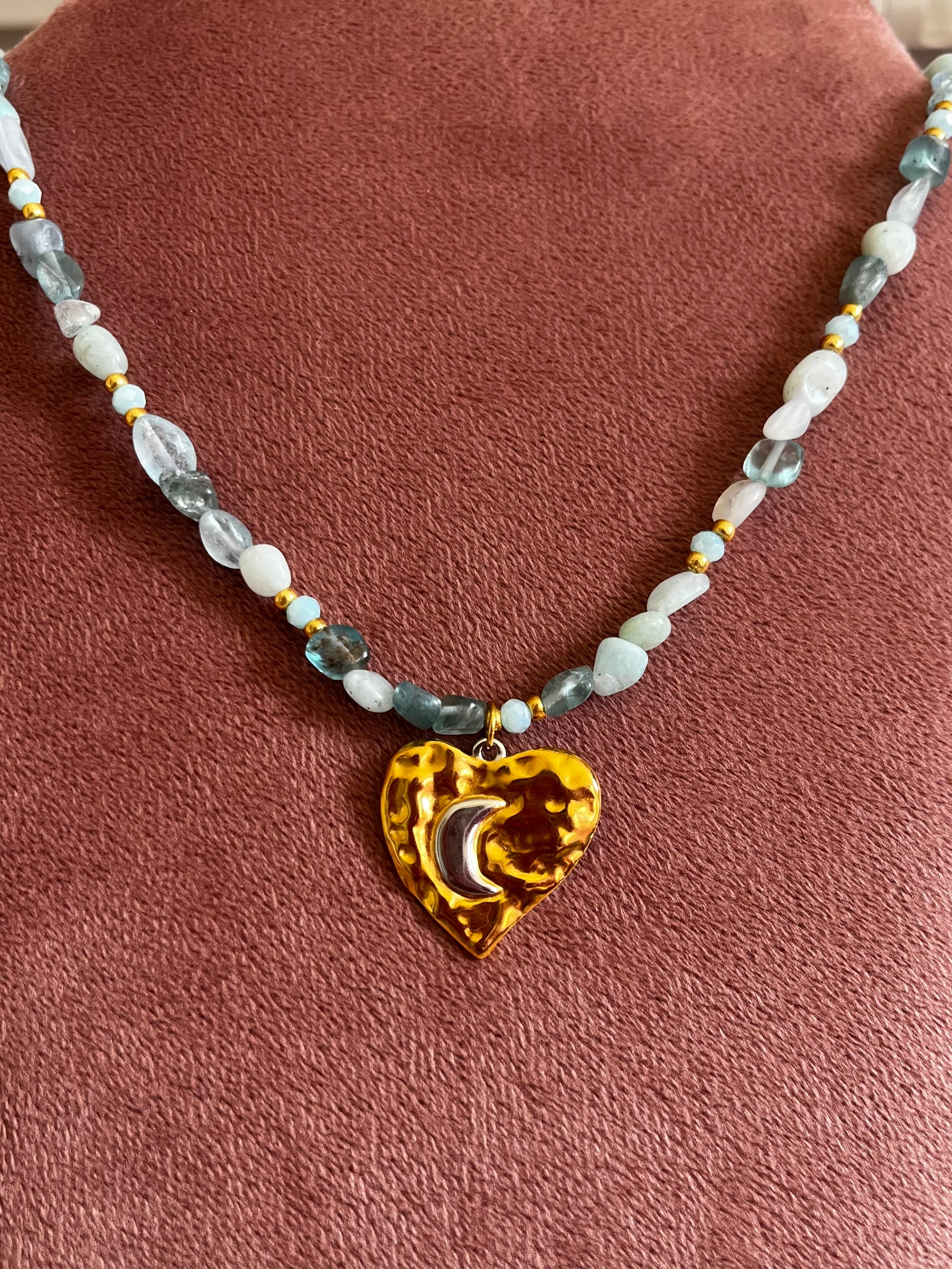 Kralenketting Lichtblauw met Hart/Maan Bedel